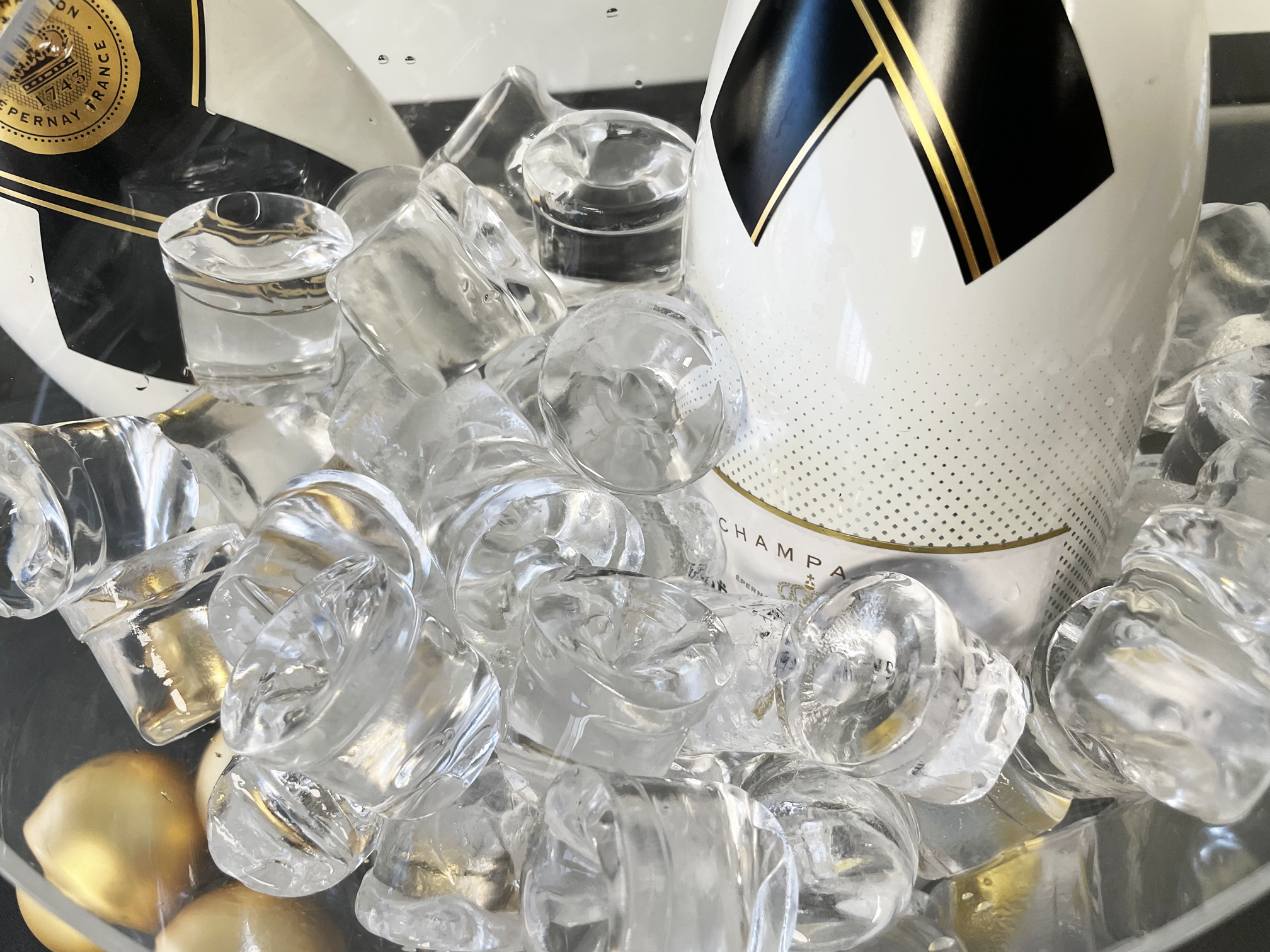 Scotsman Gourmet Supercube ice in an ice bucket with Moet Champagne